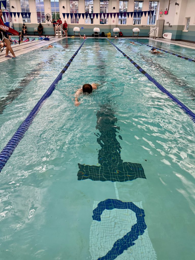 Ken swimming toward the camera