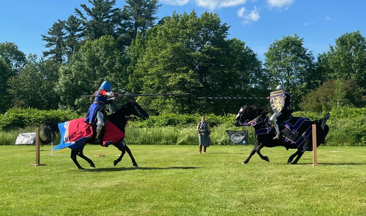 Two mounted knights jousting