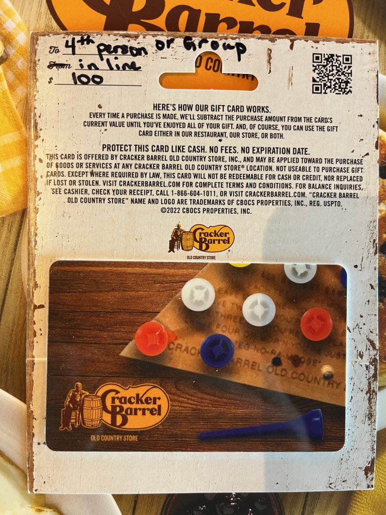 A $100 Cracker Barrel gift card with a handwritten note: "4th person or group in line"