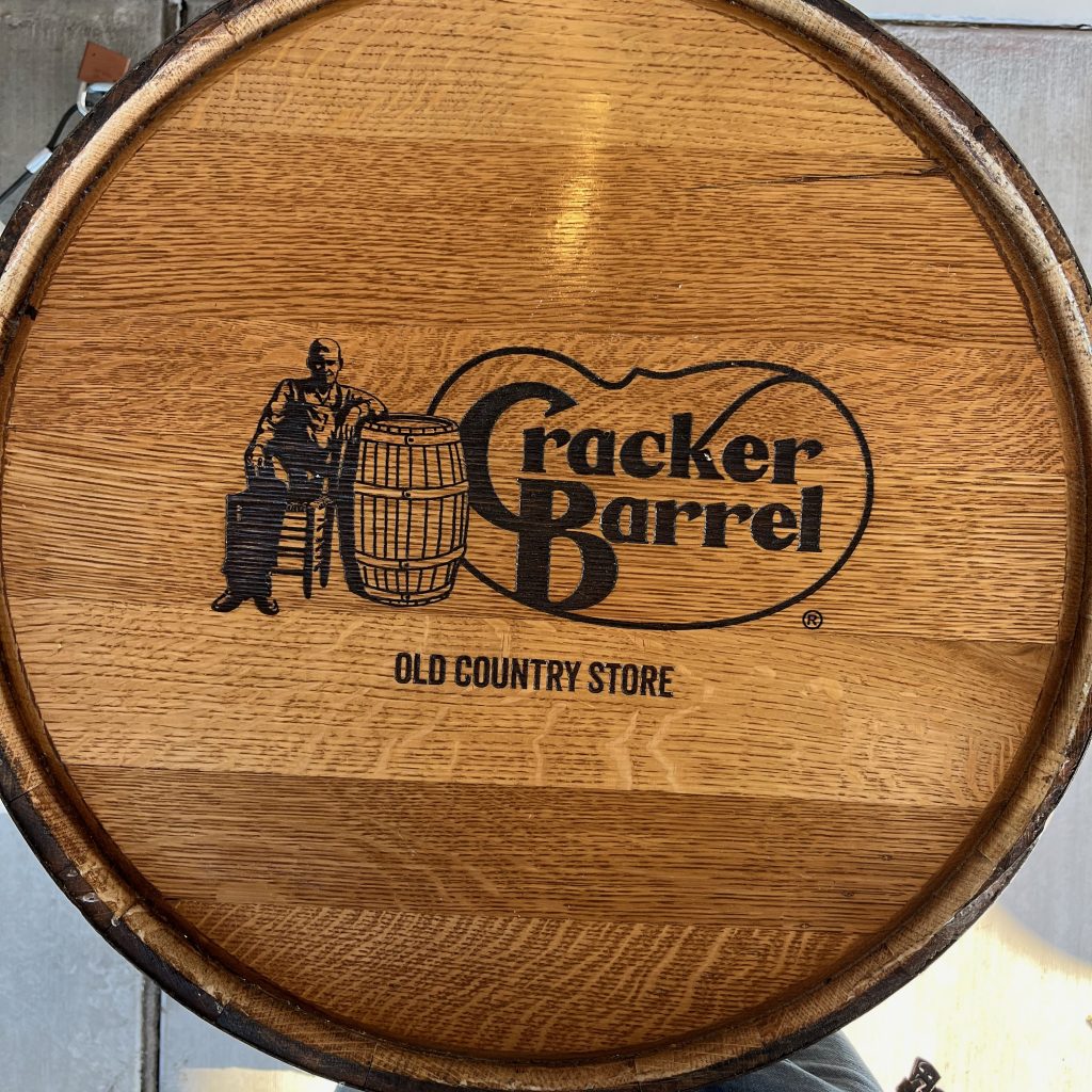 The lid of a barrel with the Cracker Barrel logo